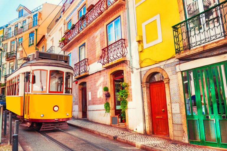 Yellow,Vintage,Tram,On,The,Street,In,Lisbon,,Portugal.,Famous