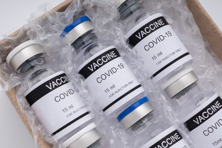 The,Covid-19,Vaccine,In,Glass,Bottles,In,A,Box,For