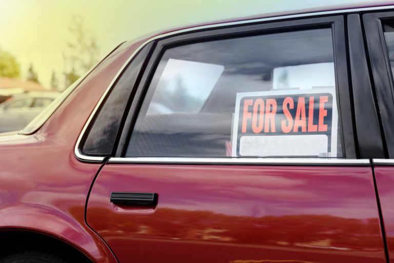 Shiny,Red,Car,For,Sale,,Parked,In,Neighborhood,In,The