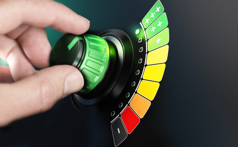 Hand,Turning,A,Knob,With,Efficiency,Scale,From,Black,And