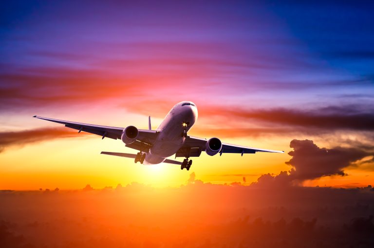 Airplane,In,The,Sky,At,Sunrise