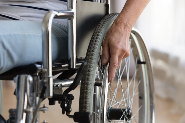 Close,Up,Of,Senior,Handicapped,Woman,Sit,In,Wheelchair,Taken