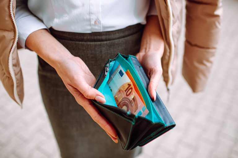Woman,Wearing,Office,Suit,Holding,Open,Wallet,With,One,Banknote.