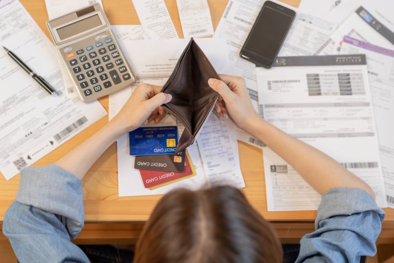 Stressed,,Problem,Business,Person,Woman,Holding,And,Open,Empty,Wallet,