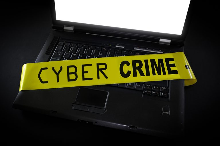 Laptop,With,Cyber,Crime,Police,Tape,Across,It