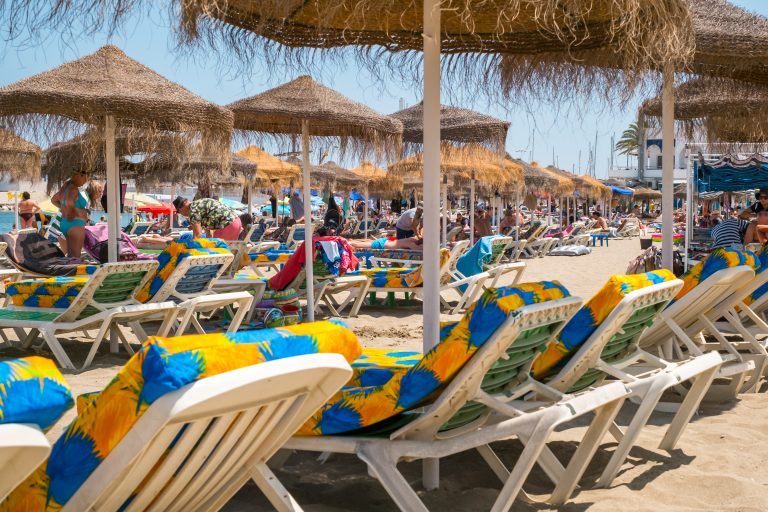 Fuengirola,,Spain,-,June,31,,2018.,People,On,Sunbeds,At