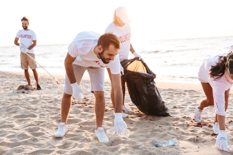 Image,Of,Smiling,Eco,Volunteers,Cleaning,Beach,From,Plastic,With