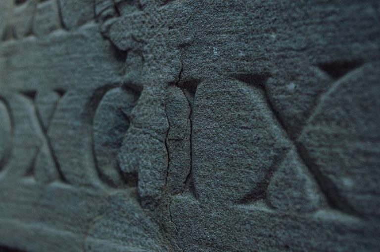 Old,Roman,Numerals,Engraved,On,A,Texture,Stone,Close,Up