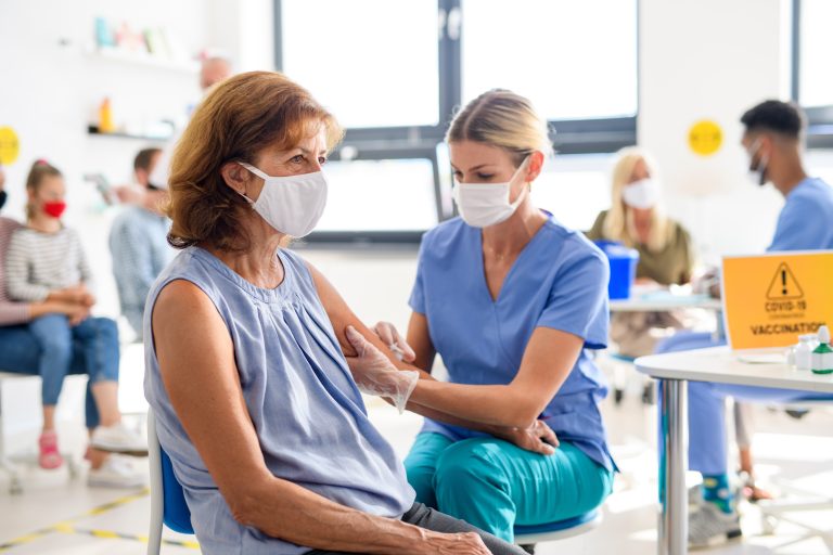 Woman,With,Face,Mask,Getting,Vaccinated,,Coronavirus,,Covid-19,And,Vaccination