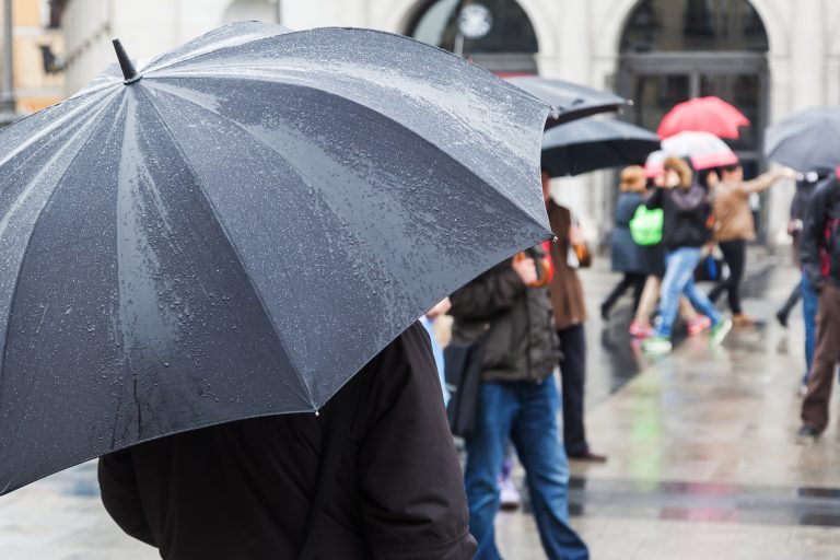 On,A,Rainy,Day,With,Rain,Umbrella,In,The,City