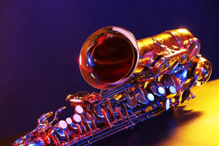 Golden,Saxophone,On,Purple,Background