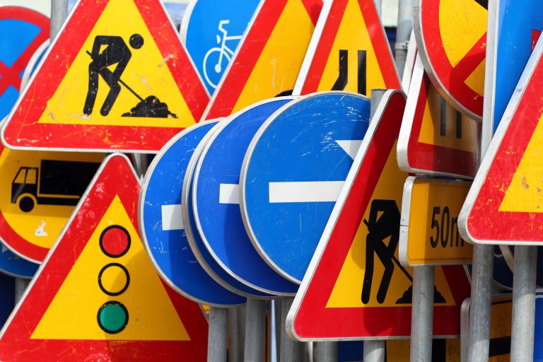Different,Colored,Traffic,Signs,In,The,Warehouse