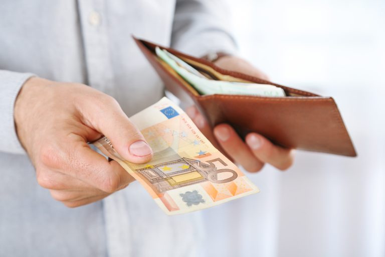 Male,Hands,Holding,Leather,Wallet,With,Euros,Closeup