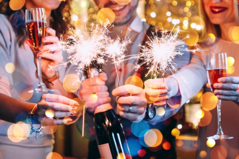 Friends,Celebrating,Christmas,Or,New,Year,Eve,With,Bengal,Lights.