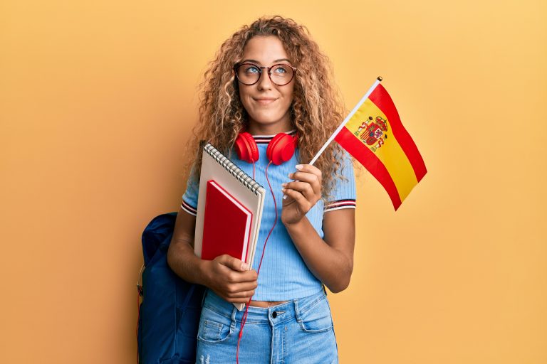Beautiful,Caucasian,Teenager,Girl,Exchange,Student,Holding,Spanish,Flag,Smiling
