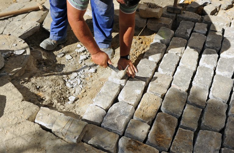 Paving,A,Street,With,Gerena,Cobblestones,,Seville,,Spain