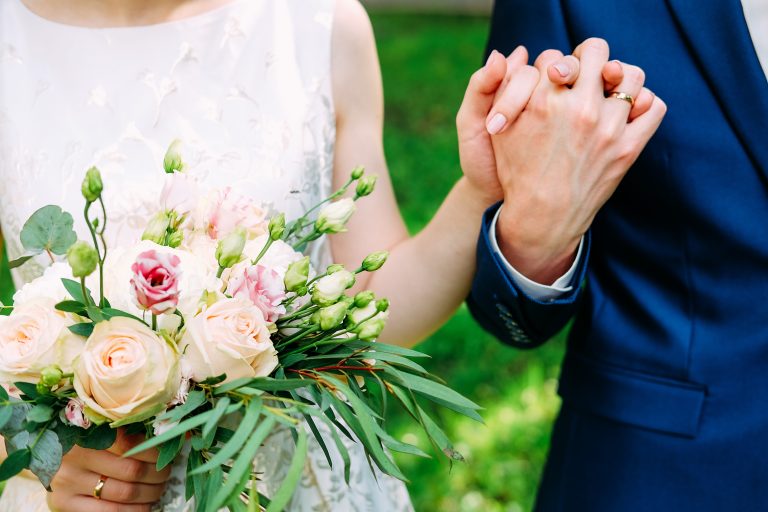Husband,And,Wife,In,Blue,Suit,And,Wedding,Dress,Getting
