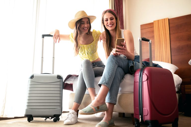 Sexy,Traveling,Girls,And,Their,Luggage,In,A,Hotel,Room
