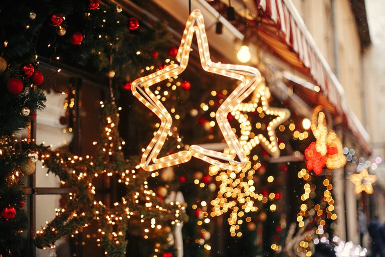 Stylish,Christmas,Golden,Star,Illumination,And,Fir,Branches,With,Red