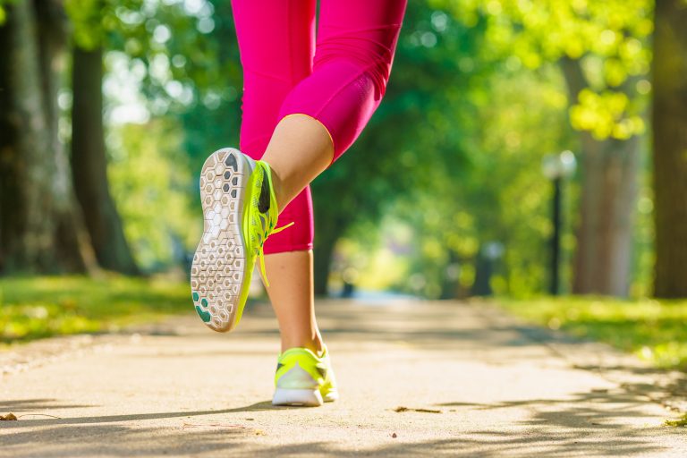 Runner,Woman,Feet,Running,On,Road,Closeup,On,Shoe.,Female