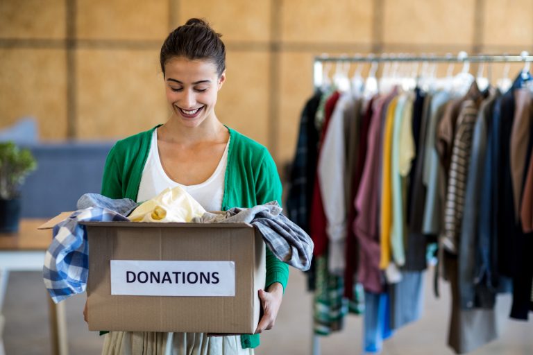 Young,Woman,With,Donation,Box,In,The,Office