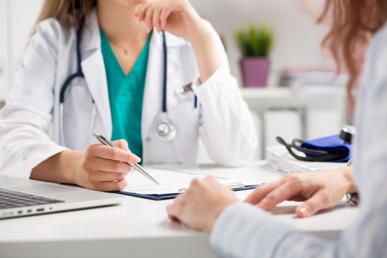 Doctor,Consulting,Patient,Hands,Closeup.,Patient,Sitting,At,Doctor,Office.