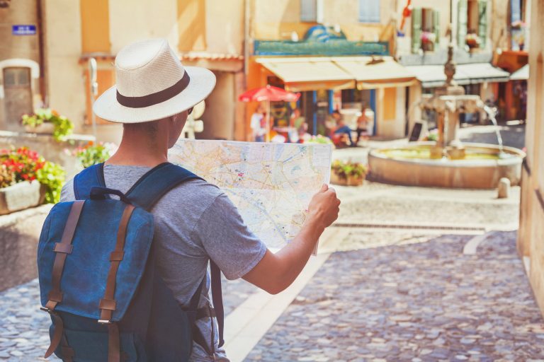 Traveling,People,,Tourist,Looking,At,Map,On,The,Street,In
