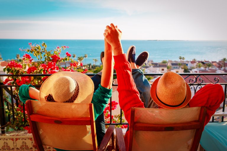Happy,Couple,Relax,On,Balcony,Terrace,,Honeymoon