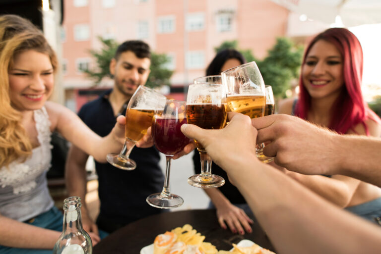 Group,Of,Friends,Making,A,Toast,With,Alcoholic,Drinks