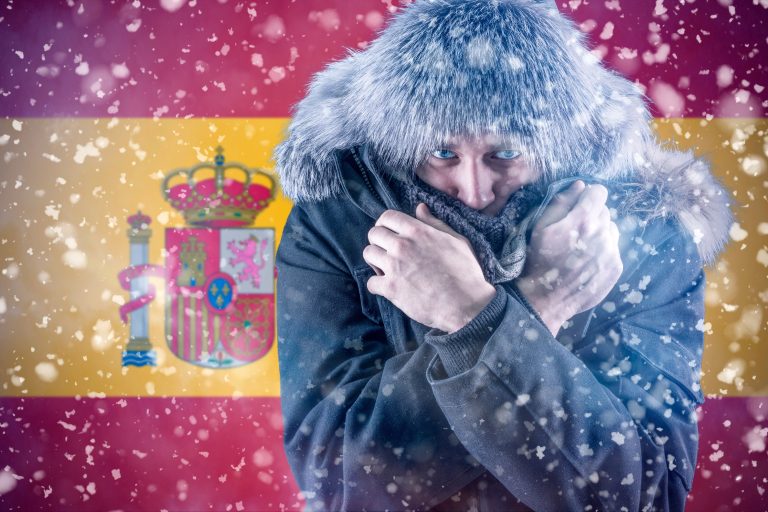 A,Citizen,Of,Spain,Freezes,In,Front,Of,The,Flag.