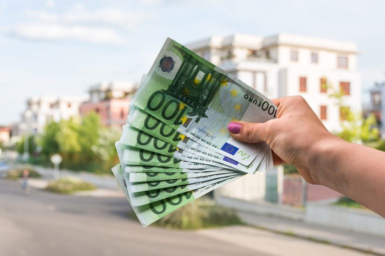 Property,Buyer,Holding,Euro,Banknotes,And,Buying,Beautiful,House,From
