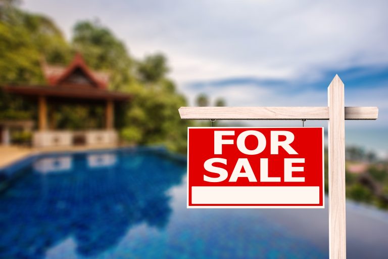 For,Sale,Sign,At,Luxury,House,With,Pool,Background