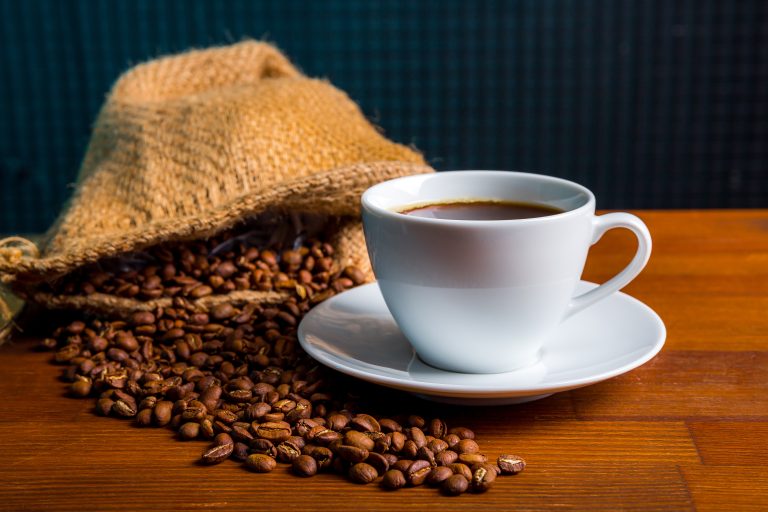 Coffee,Beans,In,A,Bag,And,A,Cup,Of,Coffee