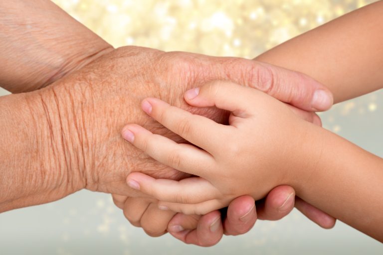 Nurse,Consoling,Her,Elderly,Patient,By,Holding,Her,Hands,-