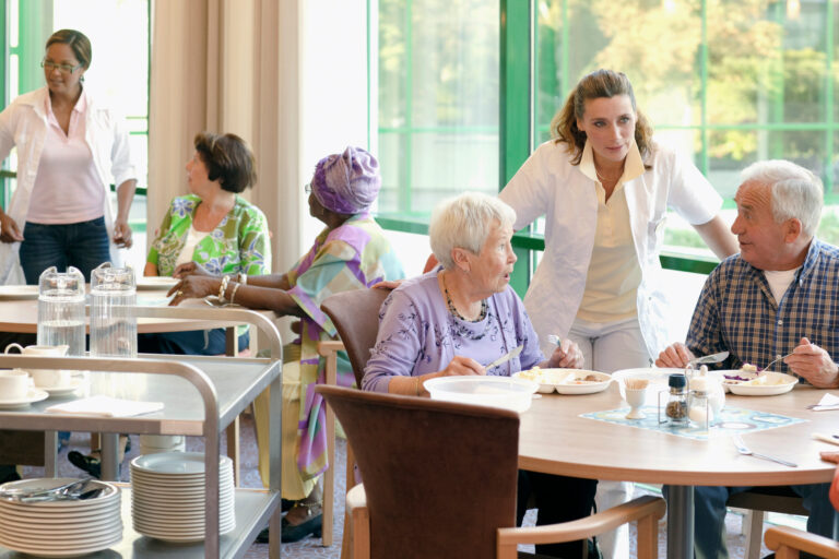 A,Group,Of,Senior,People,Having,Lunch,Together,In,A