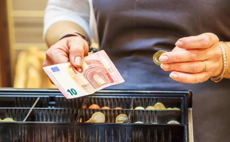 Woman,Is,Paying,In,Cash,With,Euro,Banknotes