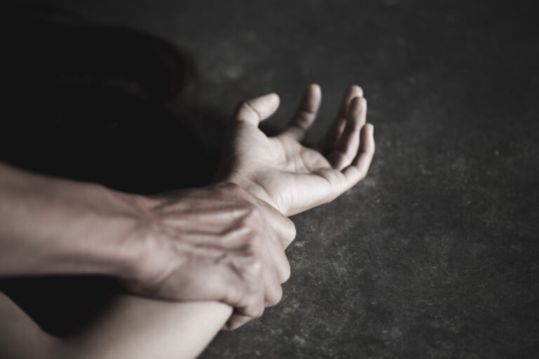 Close,Up,Man's,Hand,Holding,A,Woman,Hand,For,Rape