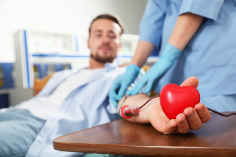 Young,Man,Making,Blood,Donation,In,Hospital,,Focus,On,Hand
