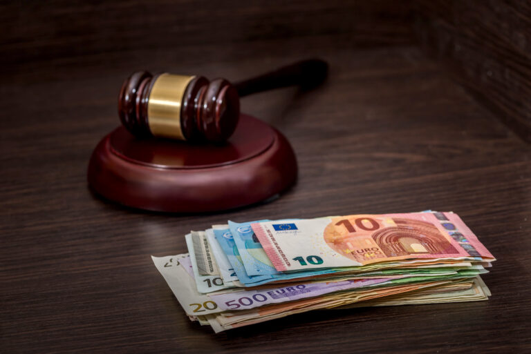 Wooden,Gavel,On,Euro,Banknotes,On,Wooden,Desk.