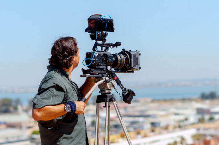 Videographer,With,Filming,Equipment,And,Film,Face