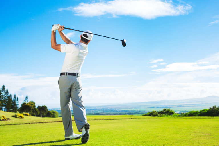 Man,Playing,Golf,On,Beautiful,Sunny,Green,Golf,Course.,Hitting