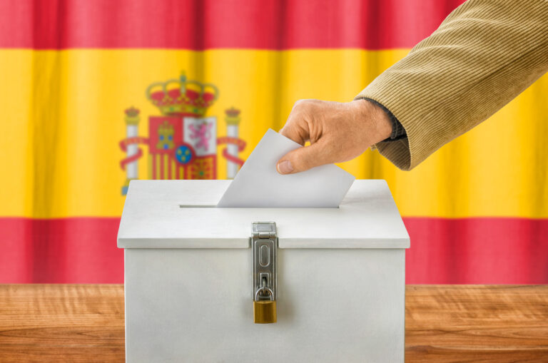 Man,Putting,A,Ballot,Into,A,Voting,Box,-,Spain