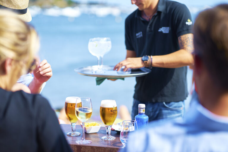 Cadaques,,Spain-aug.,19,,2017:,Bartender,Serving,Drinks,To,Travelers,On