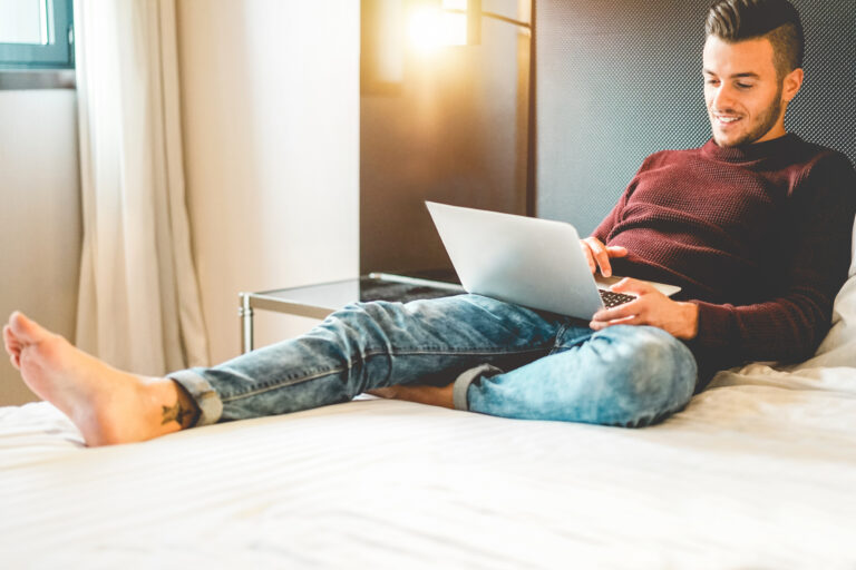 Young,Influencer,Entrepreneur,Using,Laptop,Computer,For,Working,At,Home