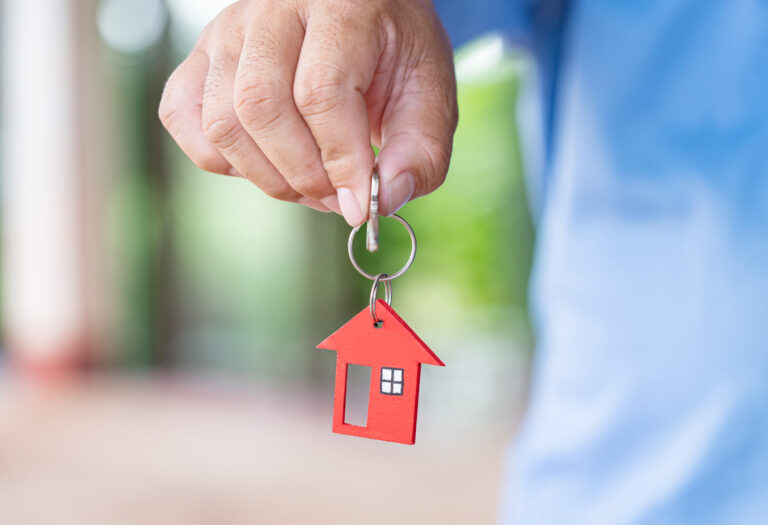 Male,Hand,Holding,House,Key,real,Estate,Agent.