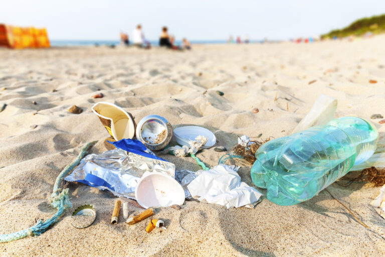 Garbage,On,A,Beach,Left,By,Tourist,At,Sunset,,Environmental