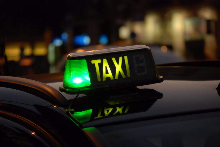Shone,Sign,On,A,Night,Taxi,In,Barcelona