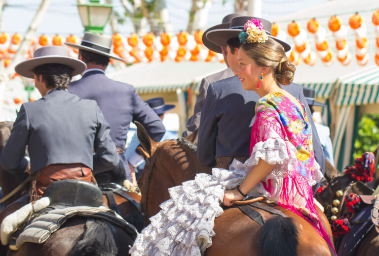 Seville,,Spain,-,Apr:,People,In,Traditional,Costumes,Riding,Horse