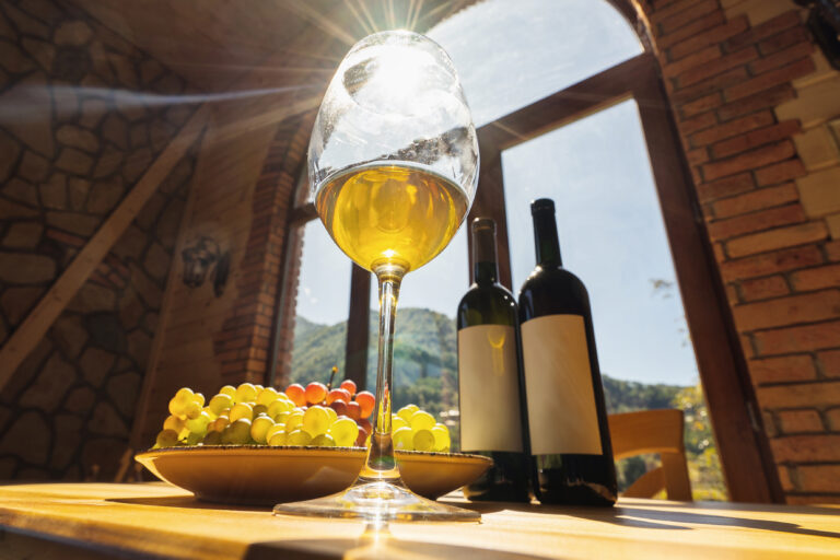 Wine,Bottles,,Grape,And,Glasse,Of,Wine,With,Sun,Rays
