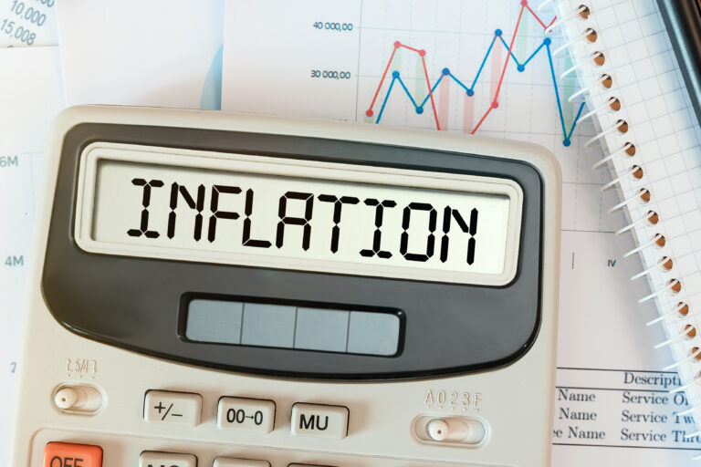 Inflation,Word,On,Calculator.,Business,And,Tax,Concept.
